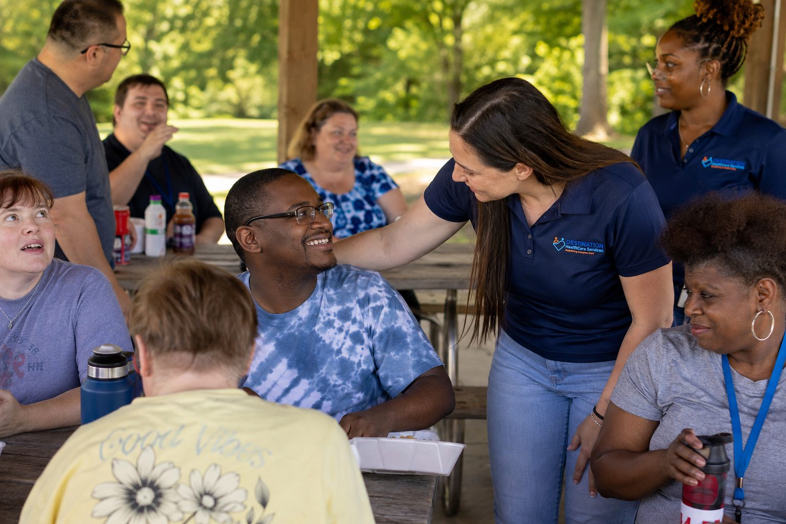 DHS caregivers and community members gathered at a park pavilion in Middle Tennessee, sharing a warm moment together